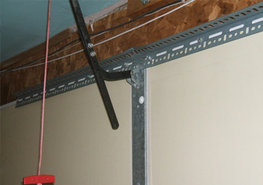 garage door bracket repair in in Granada Hills