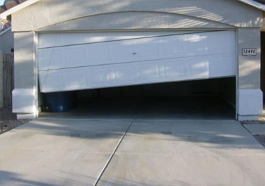 garage door off track repair in in Granada Hills